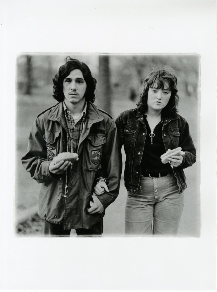 Lot #2254: DIANE ARBUS - A Young Man and His Girlfriend with Hot Dogs in the Park, N.Y.C - Original photogravure