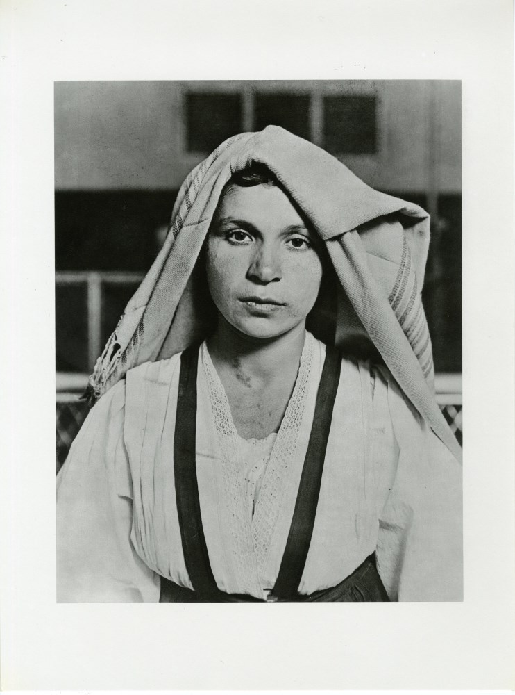 Lot #3283: LEWIS HINE - Young Albanian Woman with Folded Head Cloth, Ellis Island - Original photogravure
