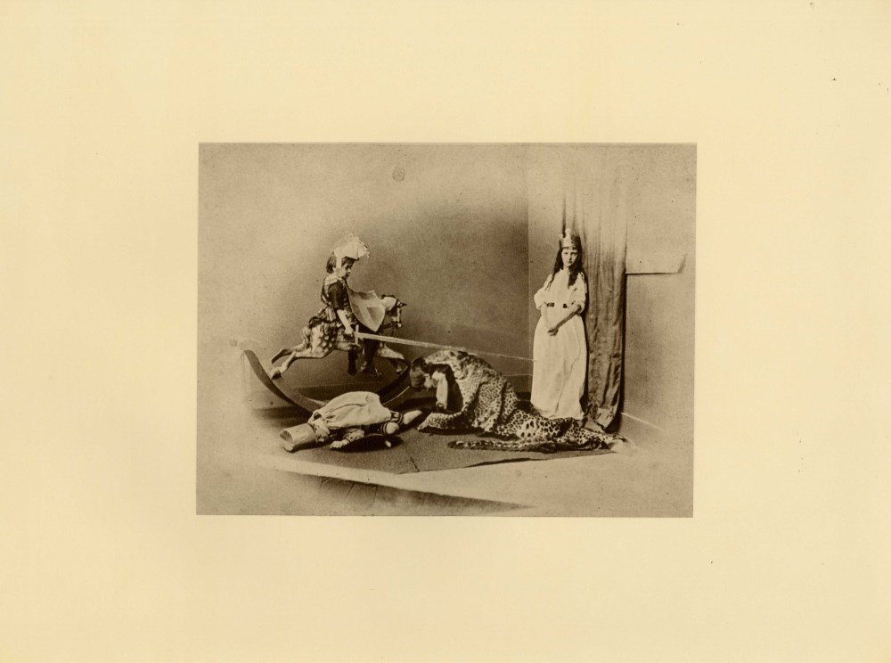 Lot #3276: LEWIS CARROLL - Xie Kitchen and Her Brothers in a Tableau, "St. George and the Dragon" - Original photogravure