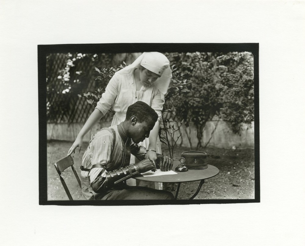 Lot #2822: LEWIS HINE - Red Cross Nurse and Man with Artificial Arm, France - Silver gelatin print